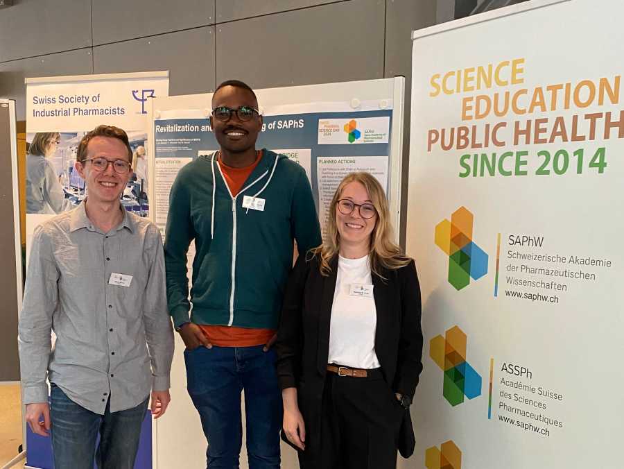 Group photo of Birrer, Masota, and Grob at the Swiss Pharma Science Day