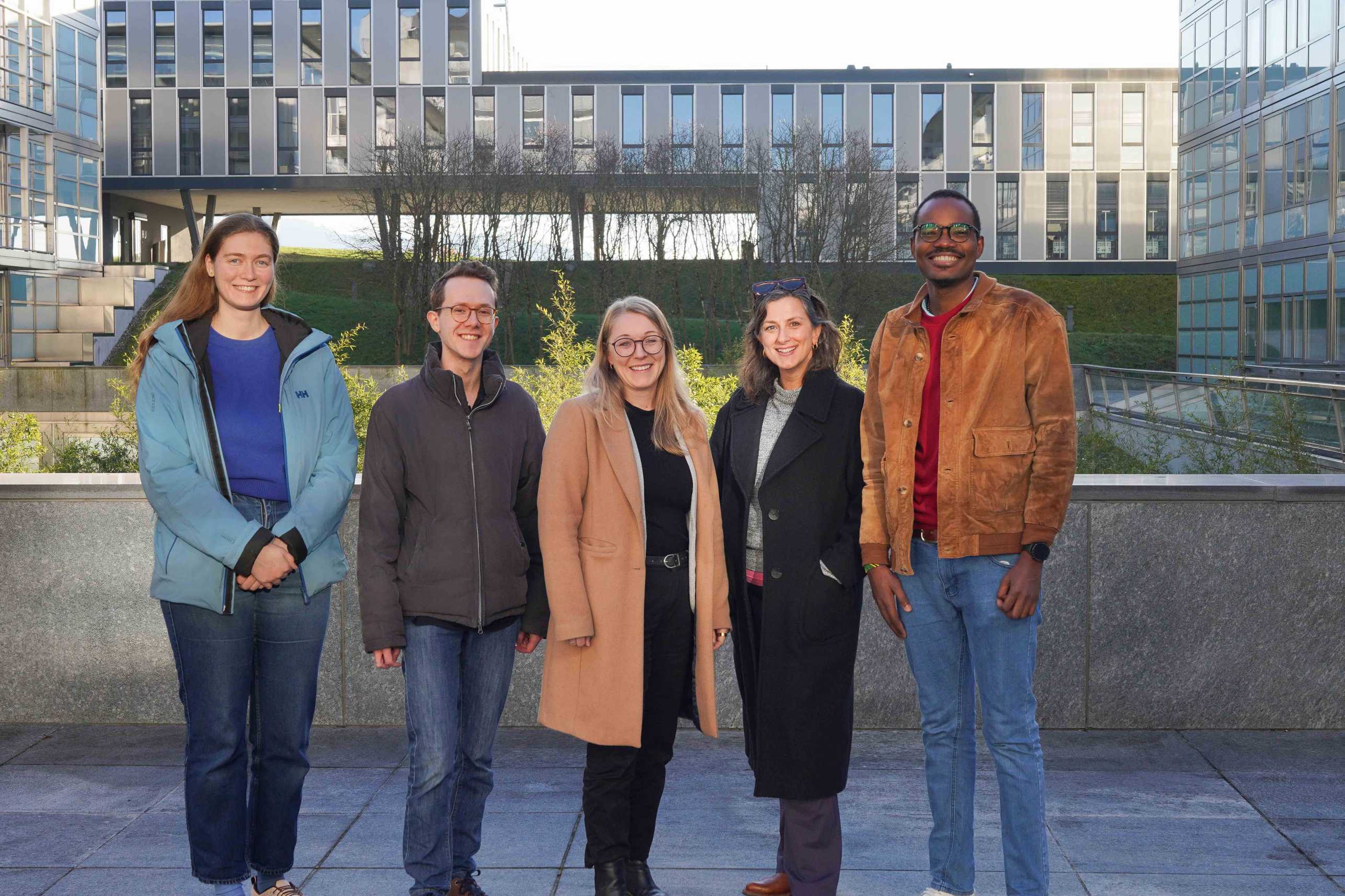 picture of the Grob group showing 5 people in front of a building